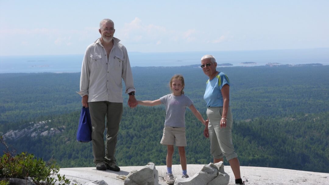 Emma Waddington with her grandparents Sue and Jim Waddington Killarney with my grandparents, at the top of Silver Peak in Killarney Provincial Park.