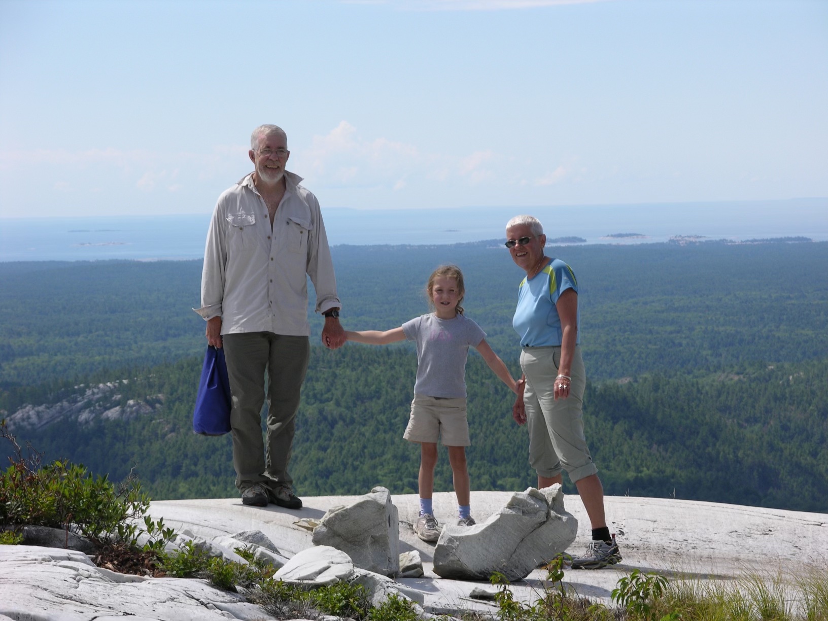 Emma Waddington with her grandparents Sue and Jim Waddington Killarney with my grandparents, at the top of Silver Peak in Killarney Provincial Park.
