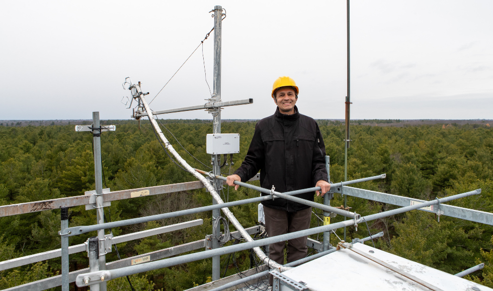 Altaf Arain at the top of a Turkey Point Environmental Observatory scaffold tower