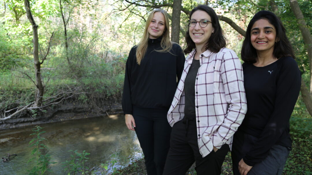 Kate Pearson, Elli Papangelakis and Priyanka Hire along the Ancaster Creek